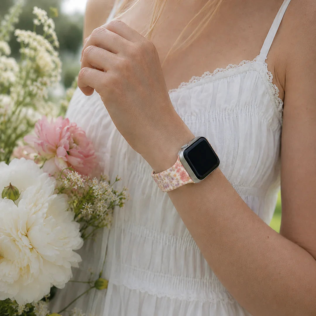 A vintage floral Apple Watch band, seen through the CELI RAE lens