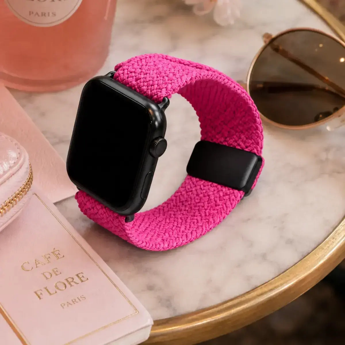 Amélie fuchsia braided Apple Watch band in a pink café flat lay