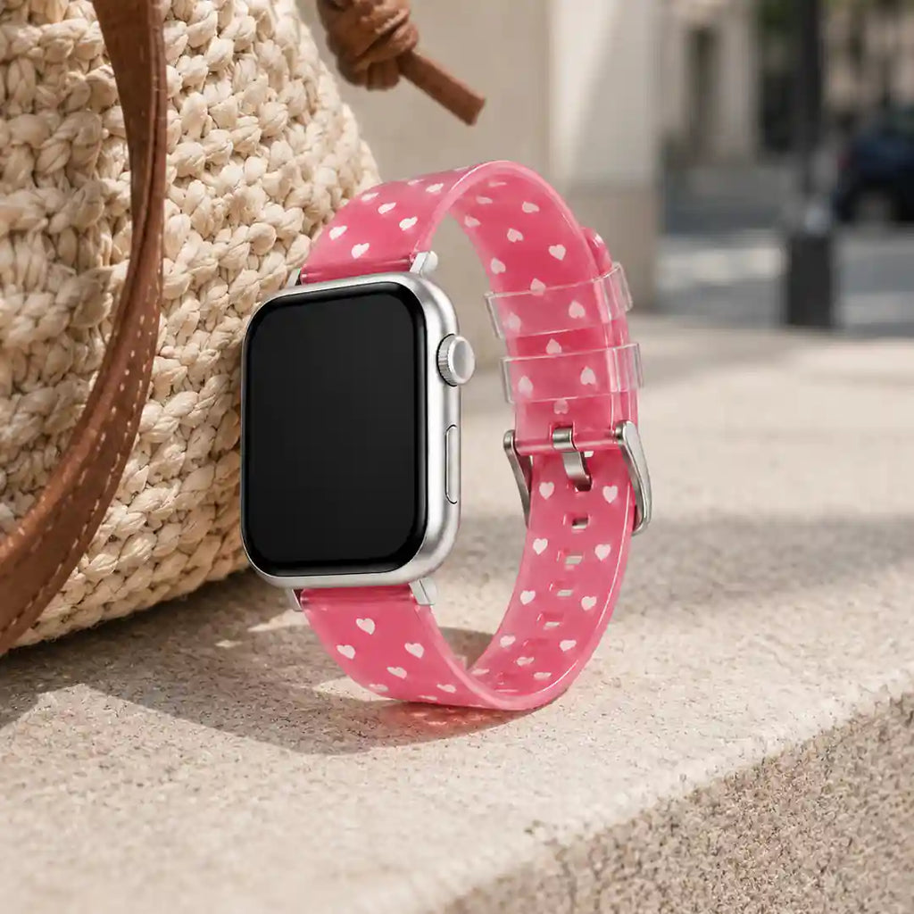 Woman wearing the Amour pink heart Apple Watch band outdoors