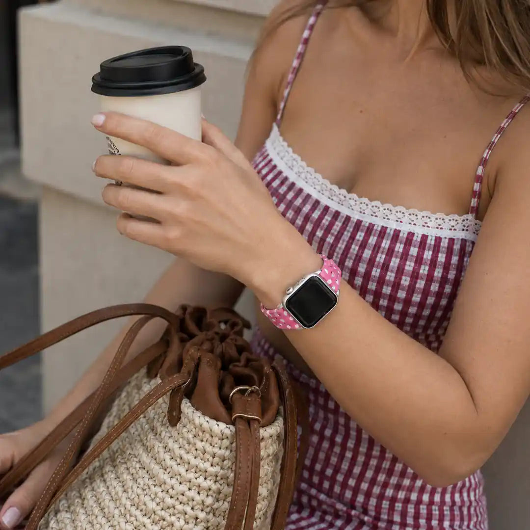 Close-up of the Amour pink heart TPU Apple Watch band on the wrist