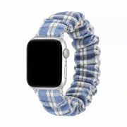 Blue gingham scrunchie Apple Watch band on a pure white background