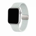 Céleste mint braided loop Apple Watch band with a silver adjustable clasp on a pure white background.