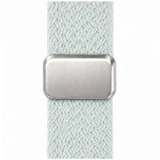 Close-up of the Céleste mint braided loop Apple Watch band and its silver adjustable clasp.