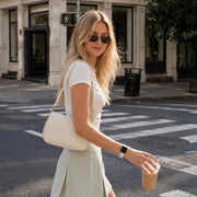 Street-style outfit with the Céleste mint braided loop Apple Watch band