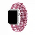 Élise burgundy gingham scrunchie Apple Watch band with a silver case on a pure white background.