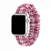 Élise burgundy gingham scrunchie Apple Watch band with a silver case on a pure white background.