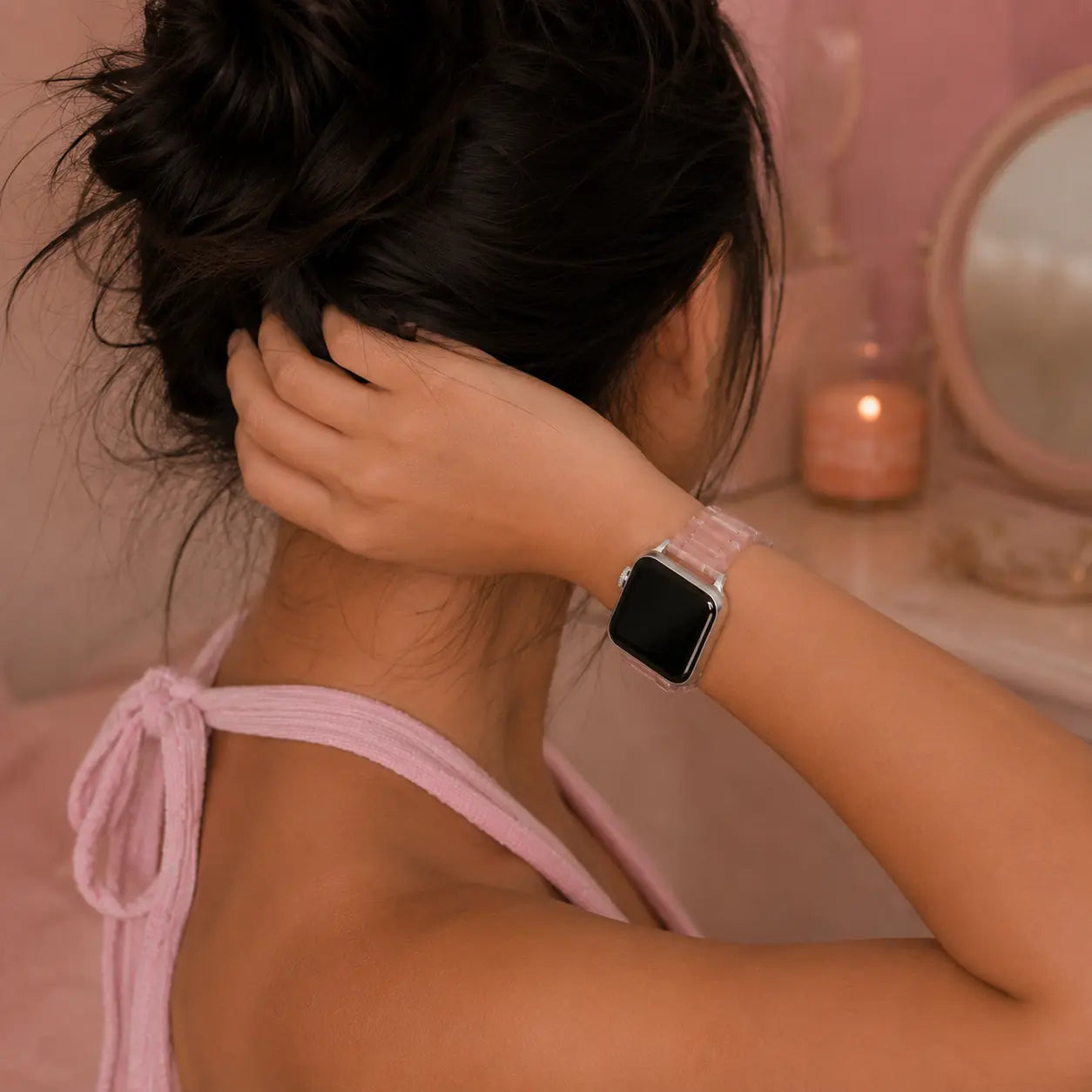 Juliette translucent pink resin Apple Watch band worn on wrist, side view