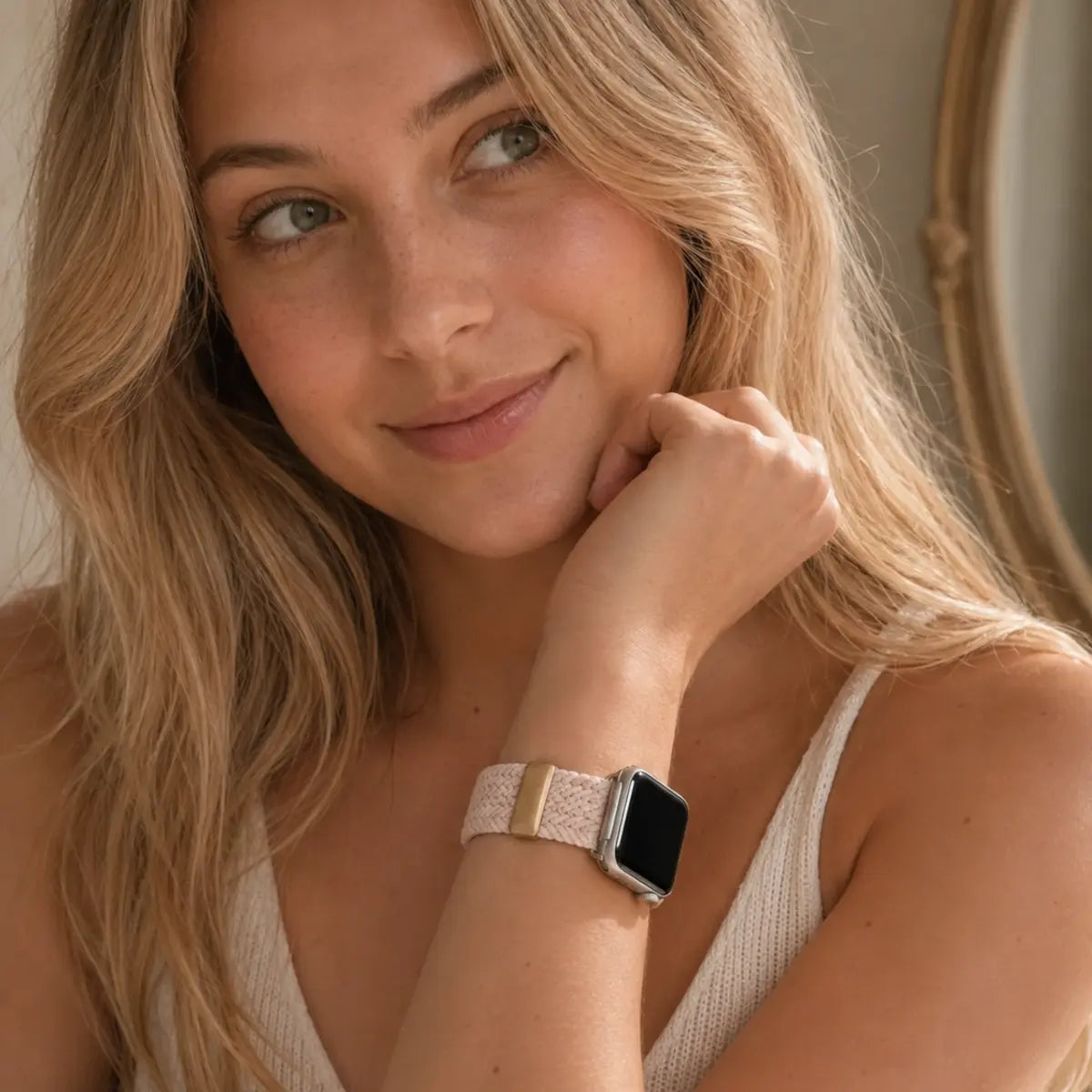Warm portrait with the Margaux blush braided loop Apple Watch band