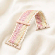 Close detail of the Rosalie pastel woven Apple Watch band and sliding loop