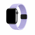 Soline lavender braided loop Apple Watch band with a black watch case on a pure white background.