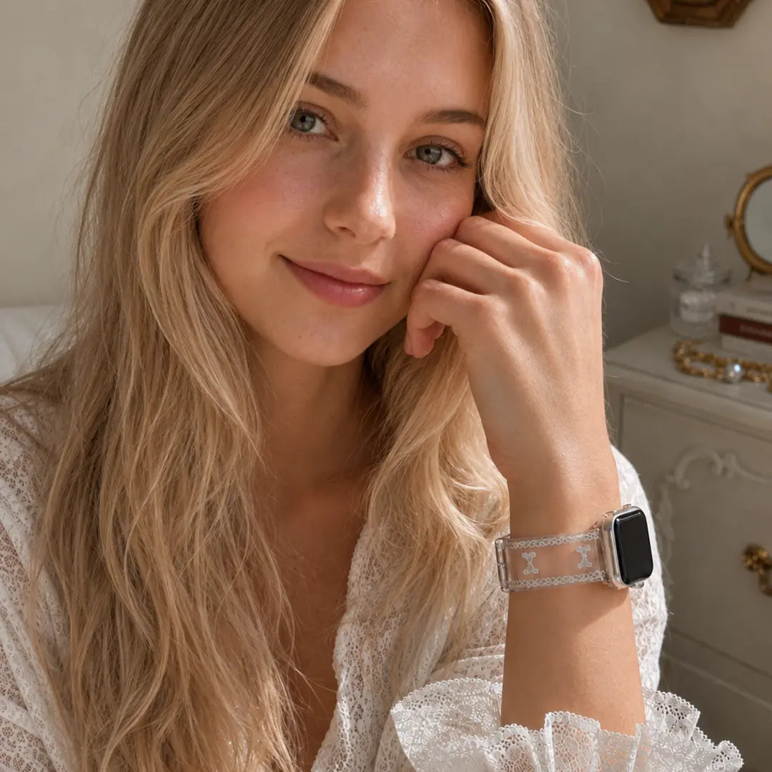 Woman wearing the Odette clear bow lace TPU Apple Watch band with a white lace blouse