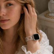 Blonde woman wearing the Odette clear bow lace TPU Apple Watch band with a white lace blouse